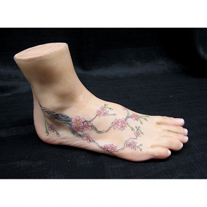 image: Prosthetic foot tattoo painting by Hudson Valley NY artist Katrie Arena.  Cherry blossom design.  Painted in 2012.